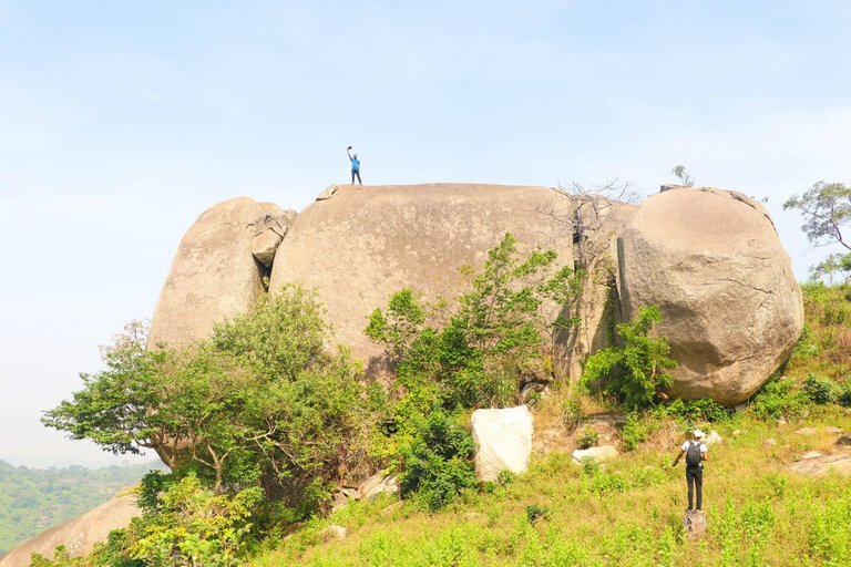 A hiker standing on the peak of Dawaki Mountain.