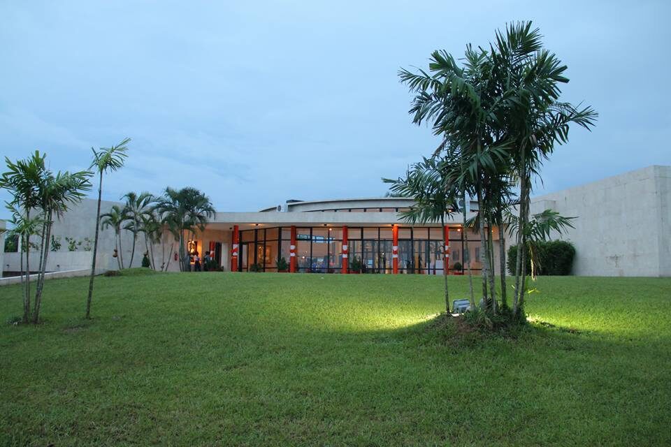 The front view of the Ibibio Heritage Museum amidst flourishing trees.