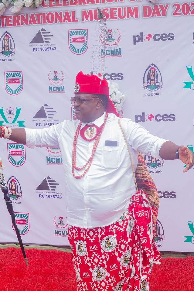 Crown Prince Chris Abasi Eyo is standing on the red carpet during a media session.