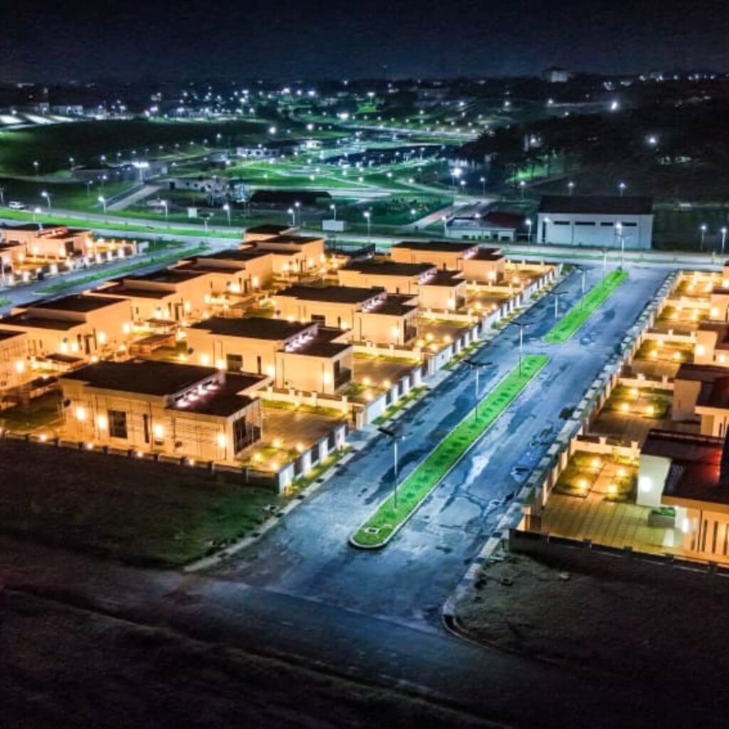 Night view of villas and chalets at Arise Palm Resort