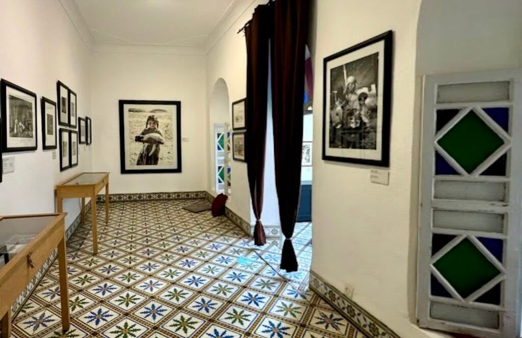 A collection of artworks and photographs inside Maison de la Photographie