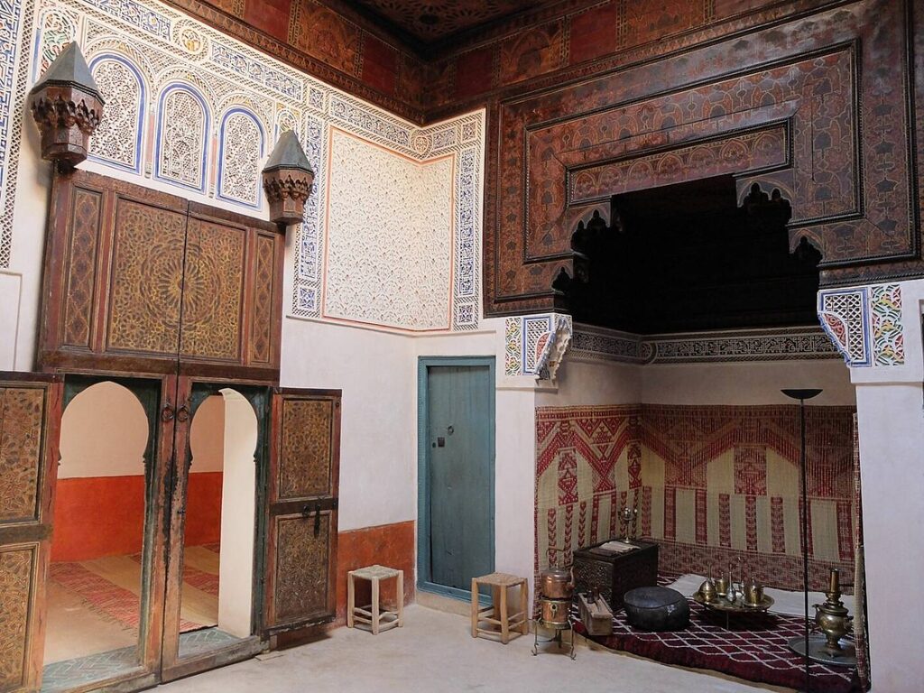 A collection of artworks amidst intricate interior designs in the Museum of Mouassine