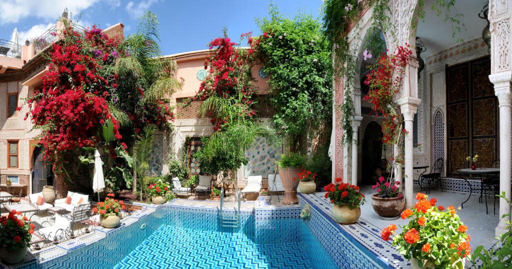 The courtyard of Riad Palais Sebban with an array of flowers