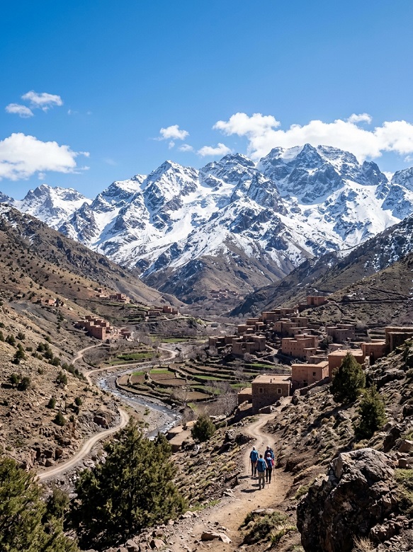 A group of tourists hiking the High Atlas Mountains in Morocco