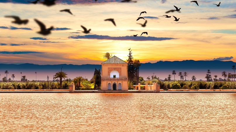 cenic view of the Menara Garden in Marrakech, Morocco, at sunset